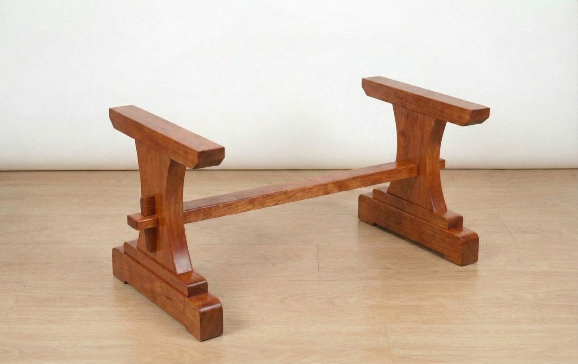 The Heritage solid wood trestle coffee table base mission style, hero lifestyle view – Artisan & Sons